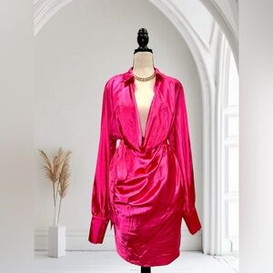 Long sleeve satin wrap dress. Deep V-neck with a tie at the waist.